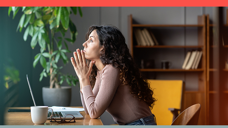 Employee looking away from computer, doing what has been labeled as quiet quitting